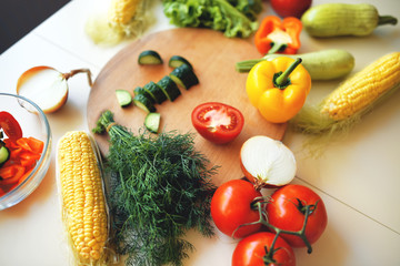 Seasonal vegetables on a bright kitchen table.