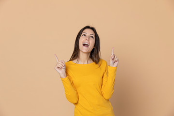 Attractive young girl wearing a yellow T-shirt