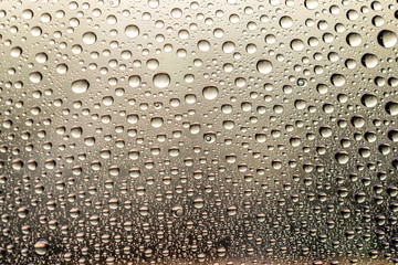 Water drops on window glass. Rain texture or wet pattern background.