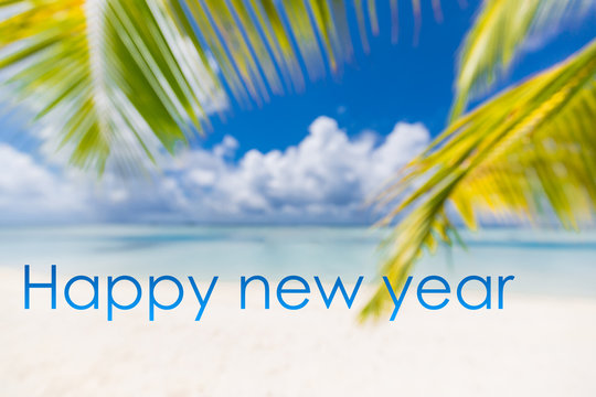Happy New Year is coming concept sandy tropical beach lettering. Exotic New Year celebration concept image. Summer vacation and travel landscape with beach swing or hammock.