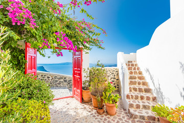 Sea view and architecture in Thira, Santorini, Greece. Beautiful vertical banner for luxury travel...