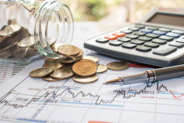 The pen is placed on a bill or payroll account with numbers placed on the table, office concept, tax calculation office, financial office and inspection concept.