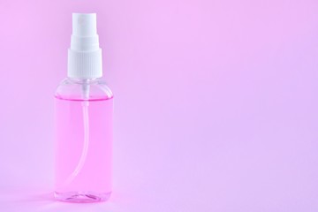 Antiseptic hand sanitizer on pink background. alcohol sanitizers or alcohol gel for hand hygiene corona virus protection. Antibacterial liquid against covid-19, virus, flu coronavirus.