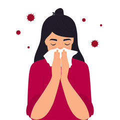 COVID-19. Coronavirus symptoms. The girl is coughing behind a napkin. Runny nose