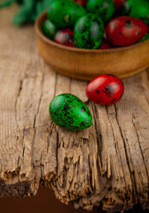 Easter eggs background. Green and red eggs. Colorful Quail colored eggs. Place for text. Different little painted egg set. Dietary nutrition. 