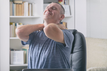 Man suffering from neck pain