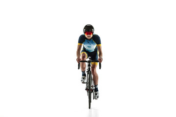 Obraz na płótnie Canvas Triathlon male athlete cycle training isolated on white studio background. Caucasian fit triathlete practicing in cycling wearing sports equipment. Concept of healthy lifestyle, sport, action, motion.