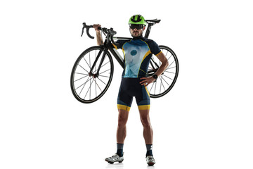 Triathlon male athlete cycle training isolated on white studio background. Caucasian fit triathlete...