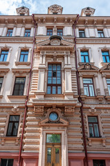 The facade of an old apartment residential building