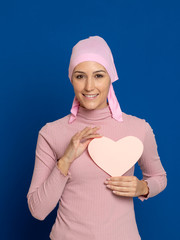 Young woman with pink scarf on the head