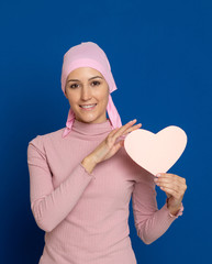 Young woman with pink scarf on the head