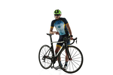 Naklejka premium Triathlon male athlete cycle training isolated on white studio background. Caucasian fit triathlete practicing in cycling wearing sports equipment. Concept of healthy lifestyle, sport, action, motion.