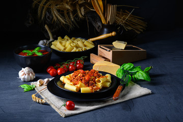 Rigatoni pasta with Bolognese sauce and fresh basil