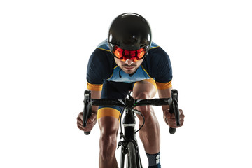 Fototapeta na wymiar Triathlon male athlete cycle training isolated on white studio background. Caucasian fit triathlete practicing in cycling wearing sports equipment. Concept of healthy lifestyle, sport, action, motion.