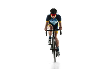 Triathlon male athlete cycle training isolated on white studio background. Caucasian fit triathlete...