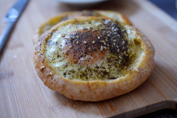 Pita with baked egg and cheese and zhatar herb