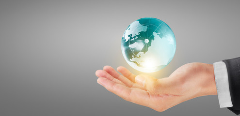 Globe earth in human hand, holding our planet glowing. Earth image Furnished by Nasa