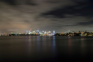 Fototapeta na wymiar Night shot of the skyline of Sydney with the Sydney Opera House and the Harbour Bridge.