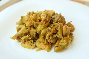  salad of seafood, mussels, raps, squids, on a white plate on a wooden background