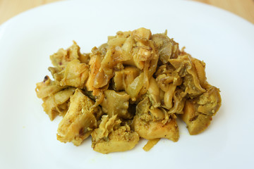  salad of seafood, mussels, raps, squids, on a white plate on a wooden background