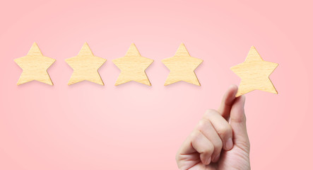 Hand of putting increase five star shape.The best excellent business services rating customer experience concept
