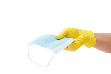 Female doctor in a glove holding a medical mask in his hand.