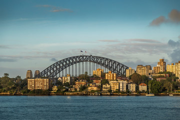The Harbour Bridge in Sydney, New South Wales in Australia during a cloudy but warm day in summer.