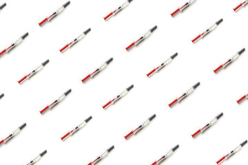 Plastic injectors pattern on white background isolated