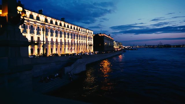 Stunning view of the illuminated buildings along Palace Embankment (including the Marble Palace) on a crisp summer night in St Petersburg. 
