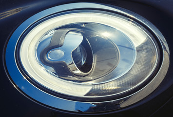 Oval car headlight, headlight with lens closeup