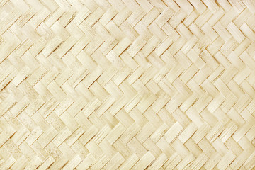 Old bamboo weaving pattern, woven rattan mat texture for background and design art work.