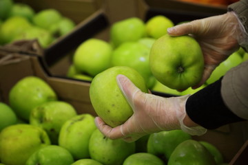 Shopping in gloves during coronavirus pandemia. The concept of safety