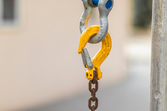 Brown chain links with yellow carabiner