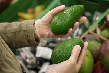 Shopping in gloves during coronavirus pandemia. The concept of safety