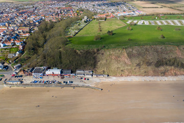 Aerial photo of the British seaside town of Filey, the seaside coastal town is located in East Yorkshire in the North Sea coast showing the beach and ocean.