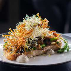 Sauteed mushrooms and poached eggs on toast