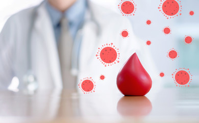 Doctor hands protracted a red blood for anti covid-19