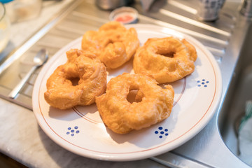 The Neapolitan pastry is called zeppola di san giuseppe, with black cherries, lemon cream with vanilla - Street Food Naples - Italy
