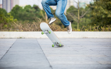 Skateboarder skateboarding at sunrise park