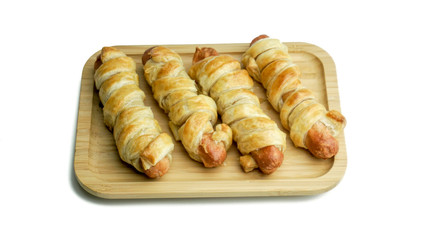 sausage rolls baked in dough. Isolated white background with clipping path