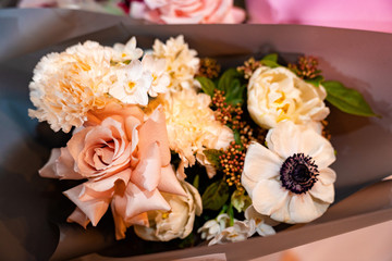 bouquet of colorful flowers in pink paper view top