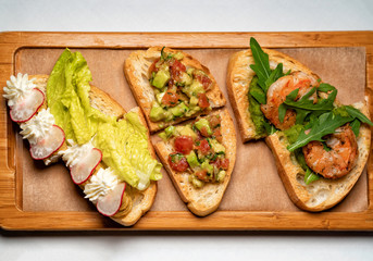 bruschetta sandwich meat and vegetables.a buffet. 