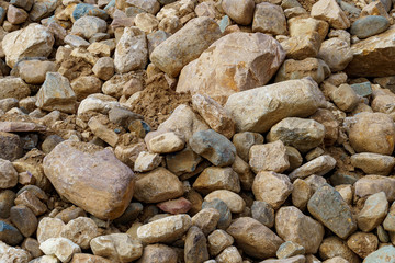 pile of cobblestones with sand