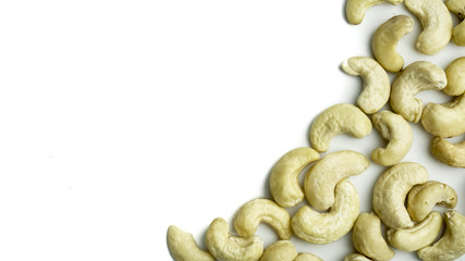 cashew nuts in the frame corner isolated on white background with copy space for your text. top view. Flat lay pattern