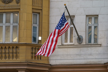 American Stars and Stripes flag on the building.