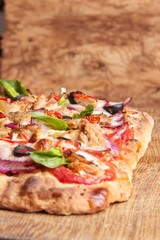 Tasty vegetarian pizza with cherry tomatoes, mozzarella cheese and basil