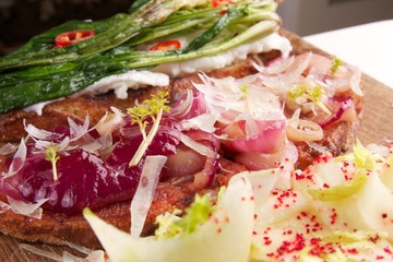 Assorted bruschetta with various toppings. Appetizing bruschetta.