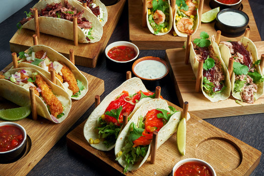 Set of different tacos with different fillings - with chicken, tomatoes, seafood. Menu Image