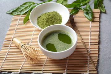 Green matcha tea drink and tea accessories on white background. Japanese tea ceremony concept. Detox tea. Antioxsidant drink