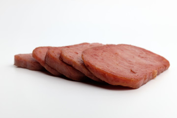 Baked canned ham on white background